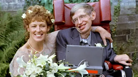 Reuters Stephen Hawking and his new bride Elaine Mason pose for pictures after the blessing of their wedding at St. Barnabus Church September 16, 1995