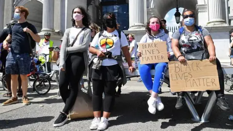 JUSTIN TALLIS/Getty Images Protesters gather at Marble Arch