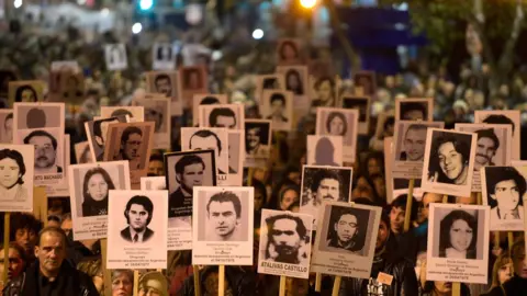 Getty Images People take part in the 22th March of Silence in memory of people who went missing during the military dictatorship (1973-1985), in Montevideo on May 20, 2017