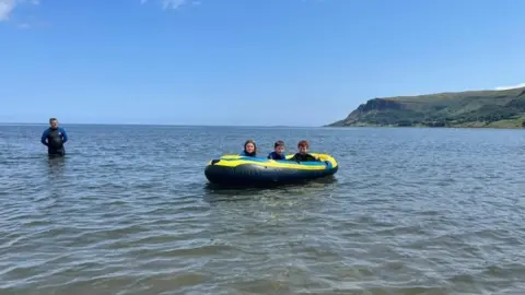 Geraldine O’Kane  Fun in the sea at Waterfoot, by