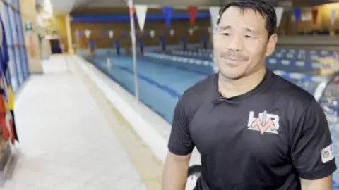 BBC Hari Budha Magar by a swimming pool