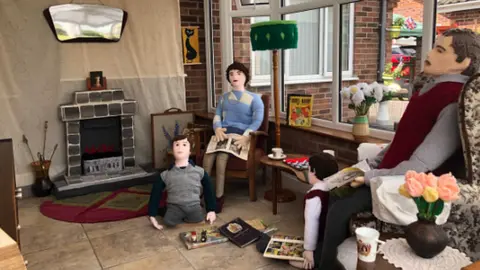 Penny Evans and Margaret Brown  Knitted family in 1950s sitting room