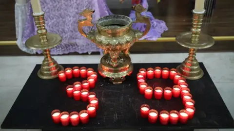 PA Media Candles spelling out 39