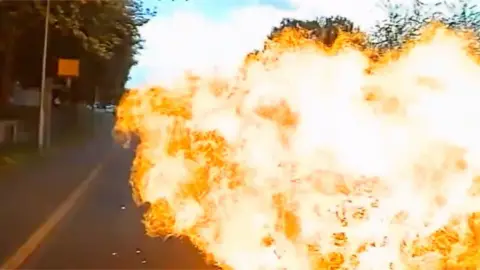 Fireball after a collision between a motorbike and car.