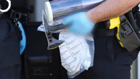 Merseyside Police Police with an axe found in raid