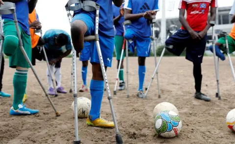 Reuters Nigeria's national amputee football team pray, Lagos, Nigeria - Friday 6 July 2018