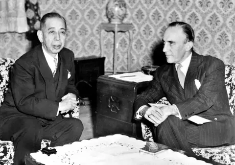 AFP Japanese Prime Minister Nobusuke Kishi sits with US Ambassador to Japan Douglas MacArthur II