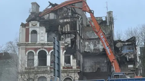 BBC Grosvenor Hotel being demolished by a crane