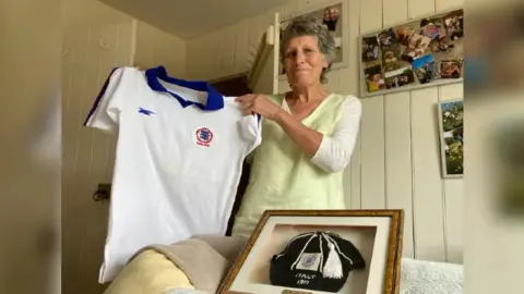 BBC Eileen Foreman holding her Lioness shirt