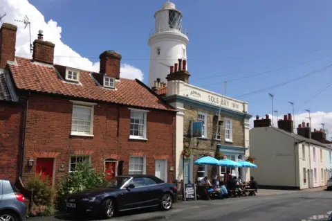 Southwold lighthouse and Sole Bay Inn