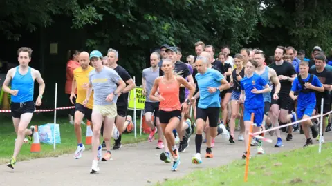 PA Media Runners at the Parkrun at Victoria Park in east Belfast after the events resumed in Northern Ireland last month