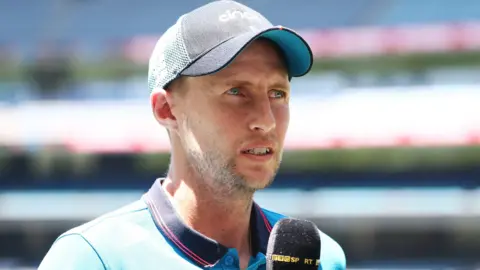 Joe Root talks to the media