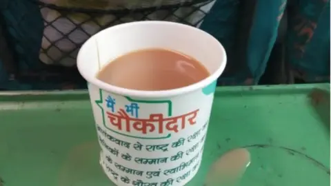 tea cups with BJP slogans on them