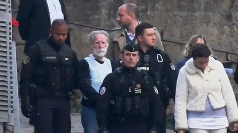 Jeremie Fulleringer/L'Yonne Républicaine Michel Fourniret with police