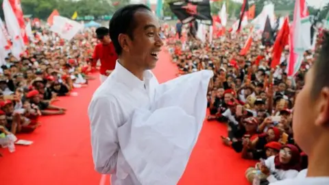 Reuters Indonesia's president and presidential candidate for the next election Joko Widodo