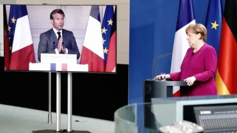 Reuters German Chancellor Angela Merkel holds a joint video news conference with French President Emmanuel Macron in Berlin