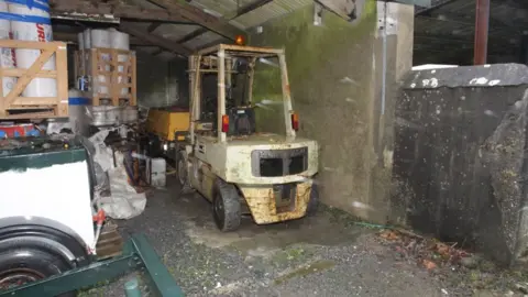 Crown Prosecution Service The forklift in a shed