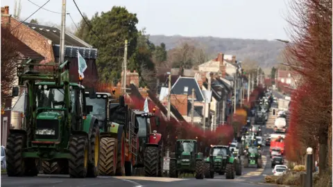 Reuters/Stephanie Lecocq Tractors queue as French farmers try to reach Paris