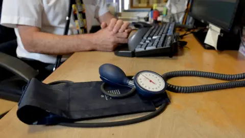 Anthony Devlin/PA General shot of a GP's blood pressure monitor