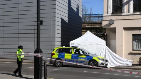 PA Scene of stabbing in east London