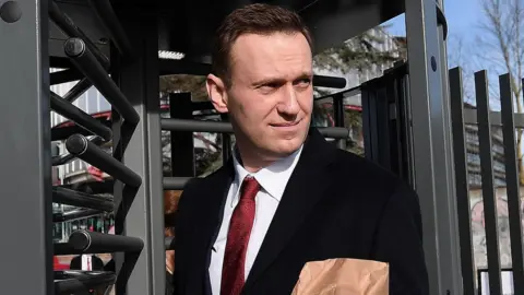 Getty Images Russian opposition leader Alexei Navalny leaves the European Court of Human Rights (ECHR) in Strasbourg, 24 January 2018