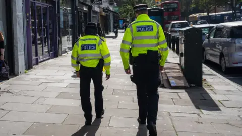 Getty Images Police officers patrol around Stamford Hill, an area of London with a large Jewish community, on October 10, 2023 in London,