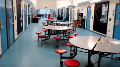 HMI Prisons Tables in a corridor inside HMYOI Cookham Wood