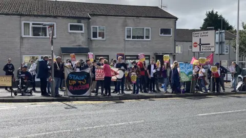 Protesters outside the site