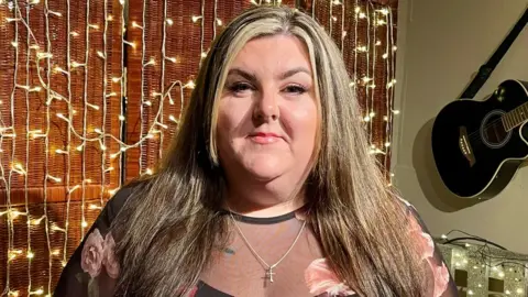 Leiha Shaw Leiha Shaw standing in her living room