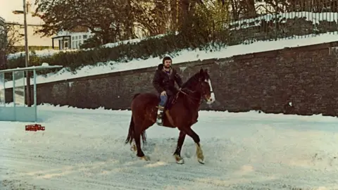 Murray Davies Man on horse in snow in Swansea - 1981