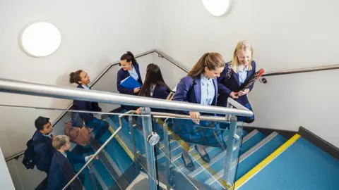 Getty Images school pupils walking up stairs