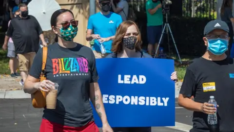 Getty Images Women stage a walkout from Activision in July 2021