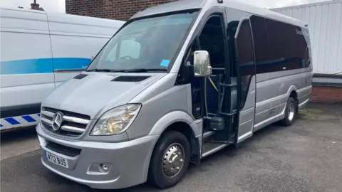 Heidi Tomlinson/BBC A silver minibus