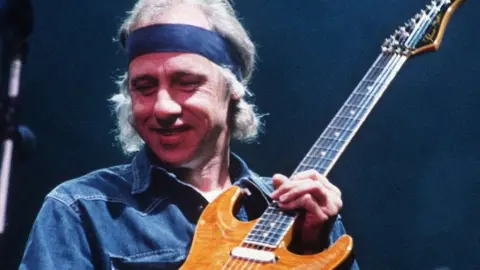 Dire Straits star Mark Knopfler's guitars sell for more than £8m at auction