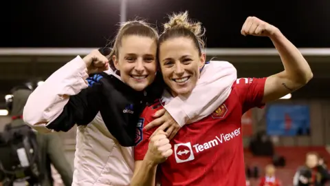 Ella Toone and Ona Battle celebrate