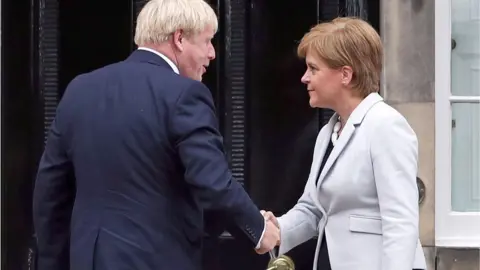 PA Media File photo dated 29/07/19 of Scotland"s First Minister Nicola Sturgeon welcoming Prime Minister Boris Johnson outside Bute House in Edinburgh.