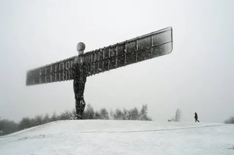 PA Media The Angel of the North sculpture covered in snow