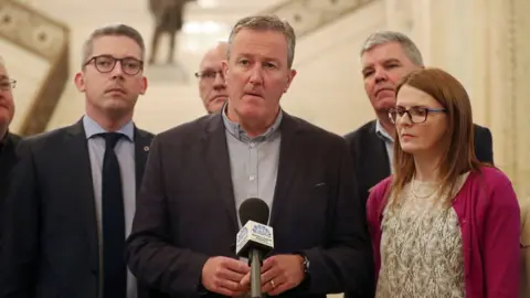 PA Sinn Féin's Conor Murphy and his party colleagues