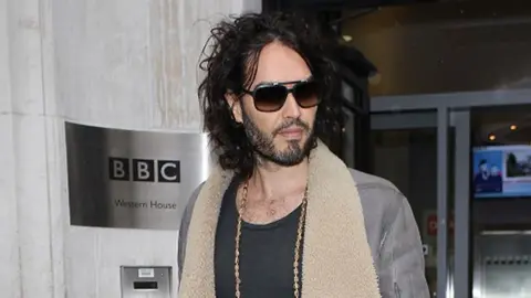 Getty Images Russell Brand pictured outside the BBC's Western House in 2014