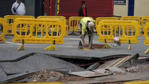 PA Media Damage to road