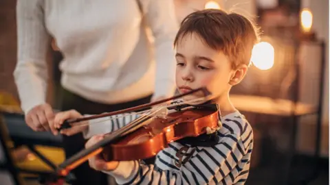 Getty Images violin lesson