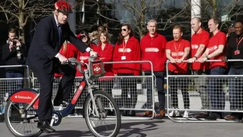 Getty Images Boris Johnson on new red 'Boris bikes'