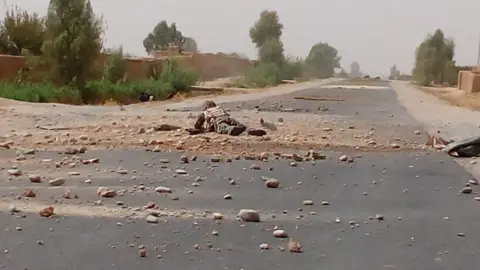 Ruhullah Rohani A soldier extracting an IED on the road to Nad Ali District