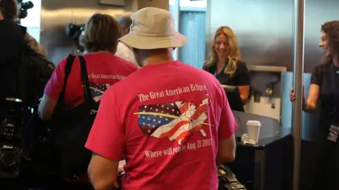 Reuters Passengers board an Alaska Airlines commercial jet to view the solar eclipse over the Pacific Ocean in Portland, Oregon, U.S., August 21, 2017.