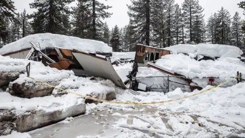 San Francisco Chronicle via Getty Images A collapsed building due to the recent snow storms is seen in Tahoe City