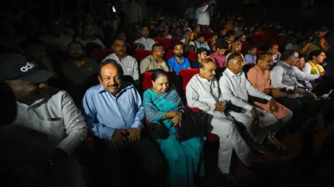 Getty Images Harsh Vardhan, BJP Leader seen along Virendra Sachdeva, Delhi BJP President, Ramvir Singh Bidhuri, Leader of Opposition in Delhi Assembly and other leaders during exclusive screening of the movie "The Kerala Story" by Delhi BJP at Delite Cinema, Asaf Ali Road on May 8, 2023 in New Delhi, India.