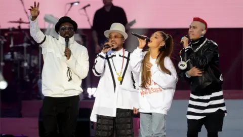 Getty Images Grande with the Black Eyed Peas