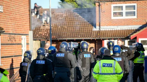 Grimsby News & Pictures Police at rooftop siege