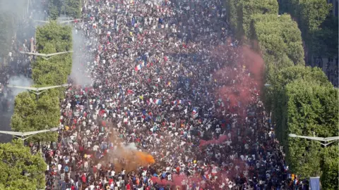 EPA French supporters celebrate on the Champs-Élysées avenue in France, 15 July 2018