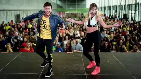 Getty Images Beto Perez dancing at a Zumba event in Spain